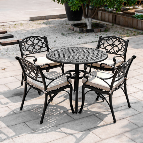 Wrought iron outdoor online dining table and chairs